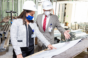Elissa Chessari, Chief Operating Officer, Northern Region, WMCHealth and Michael Gewitz, MD, Senior Vice President, Clinical Services, WMCHealth and Physician-in-Chief, Maria Fareri Children's Hospital, review plans for the new pediatrics inpatient unit.