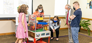 Students Show WMCHealth Representatives the Rube Goldberg Machine